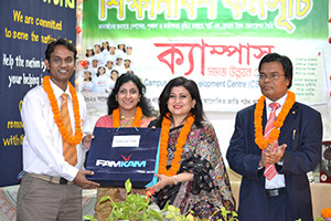 Managing Director and CEO of Green Delta Insurance Company, Farzanah                  Chowdhury, is giving Special Gift to the Best Co-leader of the Apprenticeship Program as Chief Guest; Dr. M Helal is presiding over. (2014)